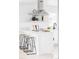 Modern kitchen island featuring bar stools, quartz countertops, and modern decor at 1405 Eaton St, Lakewood, CO 80214
