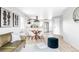 A spacious living area featuring modern design and a dining space at 1405 Eaton St, Lakewood, CO 80214