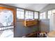 This cozy sunroom features multiple windows for natural light and offers a peaceful retreat with a view of the outdoors at 234 S Washington St, Denver, CO 80209