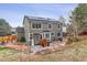 A two-story gray house with solar panels and a backyard patio at 5370 S Flanders Way, Centennial, CO 80015