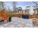 Landscaped backyard with mature trees, green grass, a patio, and outdoor seating areas at 5370 S Flanders Way, Centennial, CO 80015