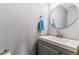 Bathroom with a grey vanity, mirror and blue towel at 5370 S Flanders Way, Centennial, CO 80015