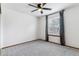Bedroom with gray carpet and a large window with dark curtains at 5370 S Flanders Way, Centennial, CO 80015