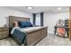 Bedroom with a king bed, nightstand and vanity with a pink chair at 5370 S Flanders Way, Centennial, CO 80015