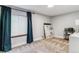 Bedroom with a window, blue curtains and artwork at 5370 S Flanders Way, Centennial, CO 80015