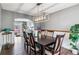 Elegant dining room featuring a modern light fixture and stylish decor, perfect for gatherings and meals at 5370 S Flanders Way, Centennial, CO 80015