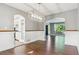 Open dining area features hardwood floors and modern lighting, connecting seamlessly to the kitchen and living spaces at 5370 S Flanders Way, Centennial, CO 80015