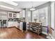 Bright kitchen featuring white cabinets, a central island, and ample natural light, perfect for cooking at 5370 S Flanders Way, Centennial, CO 80015