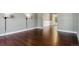 Bright living room features hardwood floors and modern sconce lighting, creating a sleek and inviting space at 5370 S Flanders Way, Centennial, CO 80015