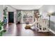 Bright living room with hardwood floors, large window, and a play area, perfect for Gathering time at 5370 S Flanders Way, Centennial, CO 80015
