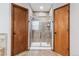 Bathroom showcasing tiled shower with glass doors at 5370 S Flanders Way, Centennial, CO 80015