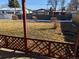 View of the backyard and wood fence from the covered patio at 5370 W Arizona Pl, Lakewood, CO 80232