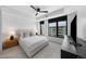 Calm bedroom showcasing neutral tones, natural light, tray ceiling and an inviting, comfortable atmosphere at 1750 Wewatta St # 1301, Denver, CO 80202