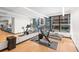 Modern gym features updated machines, large mirrors, and bright lights at 1750 Wewatta St # 1301, Denver, CO 80202