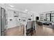 Contemporary kitchen featuring sleek white cabinetry, stainless steel appliances, and a breakfast bar at 1750 Wewatta St # 1301, Denver, CO 80202