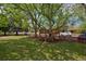 A lush backyard featuring a wooden playset at 2500 Locust St, Denver, CO 80207