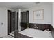 Modern bathroom featuring a soaking tub and glass-enclosed shower at 2500 Locust St, Denver, CO 80207