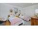 Bedroom features two twin beds, hardwood floors, and plenty of natural light from the windows at 2500 Locust St, Denver, CO 80207