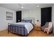 Well-lit bedroom features a modern ceiling fan and elegant furnishings with a neutral color palette at 2500 Locust St, Denver, CO 80207