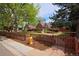Charming brick home with a fenced yard and manicured lawn at 2500 Locust St, Denver, CO 80207