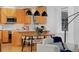 Modern kitchen featuring wood cabinets and adjacent dining area at 2500 Locust St, Denver, CO 80207