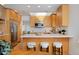 Modern kitchen with wooden cabinets, stainless steel appliances, and bright lighting at 2500 Locust St, Denver, CO 80207