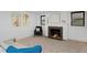 Cozy living area featuring a fireplace, comfortable seating, and neutral tones at 2500 Locust St, Denver, CO 80207