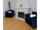 Cozy living room with a white brick fireplace and comfortable armchairs at 2500 Locust St, Denver, CO 80207