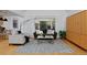 Cozy living room with large windows and hardwood flooring at 2500 Locust St, Denver, CO 80207