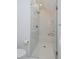 Shower stall with glass enclosure, white tile, and built-in bench at 2500 Locust St, Denver, CO 80207