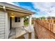 Enclosed patio with sliding glass doors and a brick privacy wall, creating a cozy backyard space at 3802 Lee Cir, Wheat Ridge, CO 80033