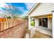 Enclosed patio with sliding glass doors and a brick privacy wall leading to the lawn at 3802 Lee Cir, Wheat Ridge, CO 80033