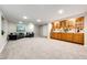 Finished basement offers a spacious seating area with wet bar and a large open space for recreation and entertaining at 3802 Lee Cir, Wheat Ridge, CO 80033