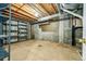 Unfinished basement featuring open ceilings, walls with a window and visible pipes and shelving at 3802 Lee Cir, Wheat Ridge, CO 80033