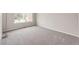 Bright, spacious bedroom featuring neutral paint, plush carpeting, and a large window at 3802 Lee Cir, Wheat Ridge, CO 80033