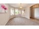 Carpeted dining room featuring ample natural light from large bay windows at 3802 Lee Cir, Wheat Ridge, CO 80033