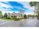 A well-maintained home on a corner lot with mature trees near a gated entry to a community at 3802 Lee Cir, Wheat Ridge, CO 80033