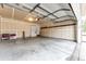 Spacious garage with shelving on the back wall and an open garage door ready for your vehicles at 3802 Lee Cir, Wheat Ridge, CO 80033