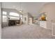 Open-concept living room with vaulted ceiling, fireplace, and adjoined dining area at 3802 Lee Cir, Wheat Ridge, CO 80033