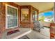 Charming covered front porch with ample seating and a welcoming entrance at 3802 Lee Cir, Wheat Ridge, CO 80033