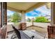 Inviting covered front porch features a comfortable bench and views of the neighborhood at 3802 Lee Cir, Wheat Ridge, CO 80033