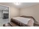 Finished basement bedroom with a comfortable bed and additional seating at 3280 Youngheart Way, Castle Rock, CO 80109