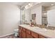 Double vanity bathroom with shower and tile accents at 3280 Young Heart Way, Castle Rock, CO 80109