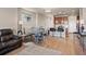 Open concept dining area with kitchen views and gray table at 3280 Youngheart Way, Castle Rock, CO 80109