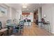 Open concept dining area with kitchen views and gray table at 3280 Young Heart Way, Castle Rock, CO 80109