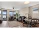 Living room with a fireplace and sliding glass doors leading to a patio at 3280 Young Heart Way, Castle Rock, CO 80109