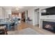 Living room with fireplace and open kitchen views at 3280 Young Heart Way, Castle Rock, CO 80109