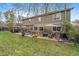 Spacious backyard with patio, hot tub, seating, and lush green lawn at 9251 Sand Hill Trl, Highlands Ranch, CO 80126