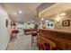 Finished basement with bar, pool table, popcorn machine, and retro decor at 9251 Sand Hill Trl, Highlands Ranch, CO 80126