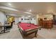 Finished basement featuring a pool table, bar area, and arcade game for entertaining at 9251 Sand Hill Trl, Highlands Ranch, CO 80126